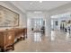 Elegant foyer with marble floors, dark wood accents, and plenty of natural light at 2450 Harbourside Dr # 233, Longboat Key, FL 34228