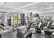Well-equipped gym featuring modern treadmills, weight machines, and a television for entertainment at 2450 Harbourside Dr # 233, Longboat Key, FL 34228