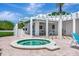 Hot tub area with lounge chairs and patio seating at 2450 Harbourside Dr # 233, Longboat Key, FL 34228