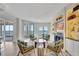 Inviting living room with fireplace, balcony access, and scenic water views at 2450 Harbourside Dr # 233, Longboat Key, FL 34228