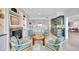 Spacious living room featuring a fireplace, view of the kitchen, and stylish furnishings at 2450 Harbourside Dr # 233, Longboat Key, FL 34228