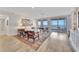 Spacious living room with floor-to-ceiling windows offering stunning views of the water at 2450 Harbourside Dr # 233, Longboat Key, FL 34228