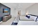 The main bedroom suite features a TV, water view, tiled floors, and sliding closet doors at 2450 Harbourside Dr # 233, Longboat Key, FL 34228