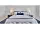 The main bedroom boasts a crisp white color palette with blue accents and carpeted floors at 2450 Harbourside Dr # 233, Longboat Key, FL 34228