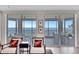 Living room features a seating area with plush chairs and breathtaking ocean views at 2450 Harbourside Dr # 233, Longboat Key, FL 34228