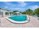 Outdoor pool with lounge chairs and patio seating at 2450 Harbourside Dr # 233, Longboat Key, FL 34228