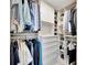 Well-organized closet with hanging space, shelves, drawers for optimal wardrobe storage at 2450 Harbourside Dr # 233, Longboat Key, FL 34228