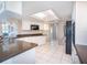 Bright kitchen with white cabinets, updated appliances, and plenty of counter space at 259 Hammock Ter, Venice, FL 34293