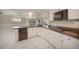 Stylish kitchen with updated countertops, modern appliances, and ample cabinet space at 259 Hammock Ter, Venice, FL 34293