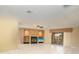 Spacious living room with fireplace, built-in shelves, and sliding door to screened in patio at 259 Hammock Ter, Venice, FL 34293