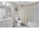 Charming bathroom featuring a vanity with a white countertop, tile floors and shower at 2819 Conch Hollow Dr, Brandon, FL 33511