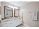 Elegant bathroom featuring dual sinks, granite countertops, and framed mirrors at 2819 Conch Hollow Dr, Brandon, FL 33511