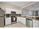 Bright, open kitchen features stainless steel appliances and granite countertops at 2819 Conch Hollow Dr, Brandon, FL 33511