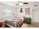 Bedroom with wood-look floors and ceiling fan at 2848 Trinidad St, Sarasota, FL 34231