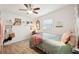 Bright bedroom with wood-look floors, decor, and natural light from the window at 2848 Trinidad St, Sarasota, FL 34231