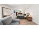 Spacious bedroom with wood floors, a sitting area, and large mirror at 2848 Trinidad St, Sarasota, FL 34231