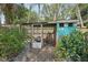 Enclosed chicken coop with quirky decor, offering a fun and functional space for poultry at 2848 Trinidad St, Sarasota, FL 34231