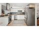 Modern kitchen with stainless steel appliances and butcher block countertops features stylish backsplash at 2848 Trinidad St, Sarasota, FL 34231