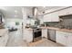 Modern kitchen with stainless steel appliances and butcher block countertops open to the living area at 2848 Trinidad St, Sarasota, FL 34231