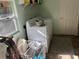 Well-lit laundry area equipped with washer, dryer, and organized storage solutions at 2848 Trinidad St, Sarasota, FL 34231