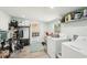 Functional laundry room with appliances, storage, and access to the outside at 2848 Trinidad St, Sarasota, FL 34231