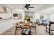 Open floor plan showcasing a dining area and living room with wood-look floors and lots of light at 2848 Trinidad St, Sarasota, FL 34231