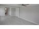Spacious bedroom with neutral paint, gray floors and adjacent bathroom at 306 Island Cir, Sarasota, FL 34242