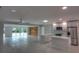 Open-concept living space with a modern kitchen and a spacious living area with sliding glass doors at 306 Island Cir, Sarasota, FL 34242