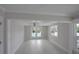 Bright living room with ceiling fan, recessed lighting, and view of outdoor pool at 306 Island Cir, Sarasota, FL 34242