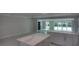 Modern open concept with a kitchen and a living area with sliding glass doors leading to the outside at 306 Island Cir, Sarasota, FL 34242