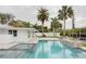 Beautiful outdoor in-ground swimming pool and spa area with canal views at 306 Island Cir, Sarasota, FL 34242