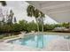 Gorgeous pool with a waterfront view perfect for entertaining guests outdoors at 306 Island Cir, Sarasota, FL 34242