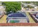 Aerial view of a home featuring solar panels and screened in-ground pool at 3136 Webber St, Sarasota, FL 34239