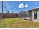 Fenced backyard featuring an in-ground pool with a screened enclosure at 3136 Webber St, Sarasota, FL 34239