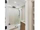 Walk-in shower features shower head, floor-to-ceiling tile, and modern fixtures at 3136 Webber St, Sarasota, FL 34239