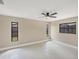 Bright bedroom with multiple windows, ceiling fan, and light wood flooring at 3136 Webber St, Sarasota, FL 34239