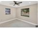 Bright bedroom with modern ceiling fan, light flooring, and views to the neighborhood at 3136 Webber St, Sarasota, FL 34239