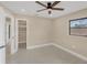 Nicely painted bedroom with ceiling fan, closet and view to the neighborhood at 3136 Webber St, Sarasota, FL 34239