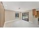 Bright dining room with modern lighting, pool views, and seamless access to the outdoor space at 3136 Webber St, Sarasota, FL 34239