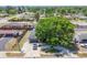 Beautiful home featuring a circular driveway and a lush, mature shade tree at 3136 Webber St, Sarasota, FL 34239