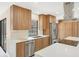 Modern kitchen featuring sleek wood cabinets, stainless steel appliances, and bright, quartz countertops at 3136 Webber St, Sarasota, FL 34239