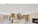 Modern kitchen featuring sleek cabinetry, a central island with quartz countertop, and stainless steel appliances at 3136 Webber St, Sarasota, FL 34239