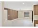 Open living room features stylish wood wall paneling, modern lighting, and a bright, airy atmosphere at 3136 Webber St, Sarasota, FL 34239