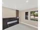 Bright living room with a modern electric fireplace and windows at 3136 Webber St, Sarasota, FL 34239