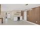 Living room with floating shelves, a bar, and a modern light fixture at 3136 Webber St, Sarasota, FL 34239