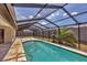 Screened-in pool area with a covered area for entertaining at 3136 Webber St, Sarasota, FL 34239