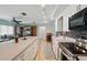 Modern kitchen with stainless steel appliances, white cabinets, and track lighting above at 3260 Pinetree St, Port Charlotte, FL 33952