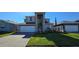 Charming two-story home boasts a manicured lawn and a paver driveway leading to an attached two-car garage at 3531 Night Star Ter, Parrish, FL 34219