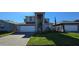 Charming two-story home boasts a manicured lawn and a paver driveway leading to an attached two-car garage at 3531 Night Star Ter, Parrish, FL 34219