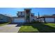 Charming two-story home boasts a manicured lawn and a paver driveway leading to an attached two-car garage at 3531 Night Star Ter, Parrish, FL 34219